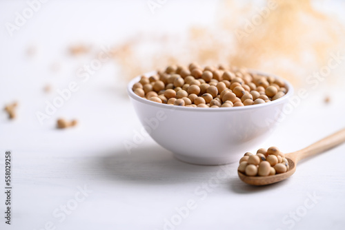 Soybean seeds in bowl with spoon, food ingredients high protein good for vegetarian and vegan
