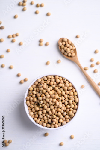 Soybean seeds in bowl with spoon, food ingredients high protein good for vegetarian and vegan