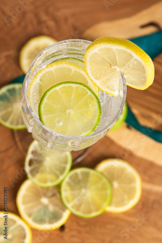 Club soda with lemon and lime, surrounded by lemon and lime slices