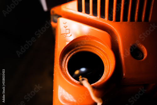 Bild auf Leinwand Open filler neck for the fuel-oil mixture in the chainsaw