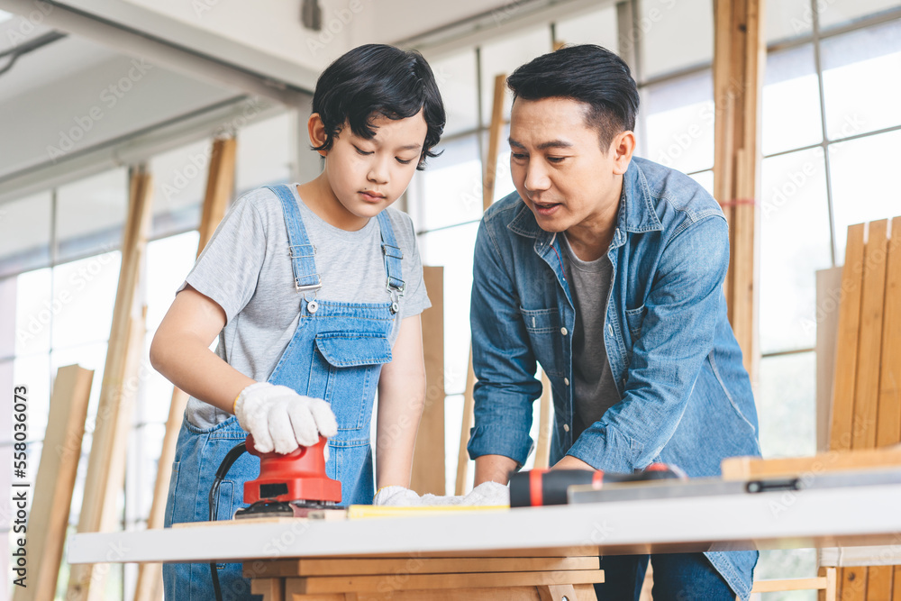 Southeast asian family father and son diy or repair for crafts skill at home workshop Southeast asian family father and son diy or repair for crafts skill at home workshop