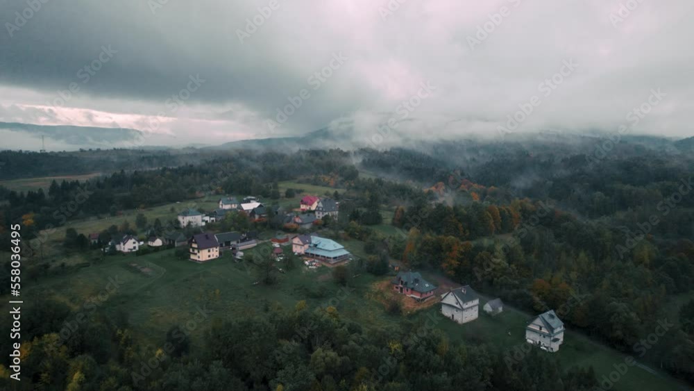 Bird Eye View of Autumn Forest in Countryside Covered by Fog and Clouds. Misty Morning Over Forest. Bird Eye View of Autumn Forest in Countryside Covered by Fog and Clouds. Misty Morning Over Forest.