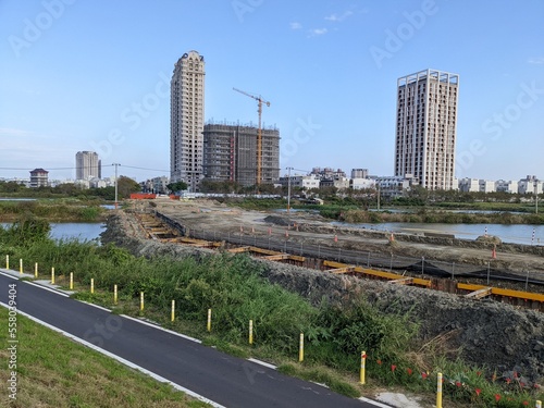 The contruction of new road in the wetland in Tainan  Taiwan. The expansion of restidual area have threaten the habitat of wild animals  expectially the water birds.