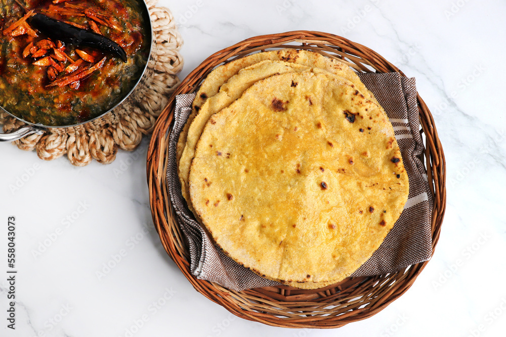 Makki di roti or Corn meal bread and mustard leaves curry. It's a popular Punjabi winter dish