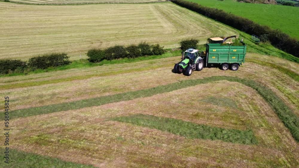 Aerial view of a New Holland FX68 Self Propelled Harvester a Deutz Fahr Tractor with a NC Trailer contracting Grass for Silage 01-01-23 Aerial view of a New Holland FX68 Self Propelled Harvester a Deutz Fahr Tractor with a NC Trailer contracting Grass for Silage 01-01-23