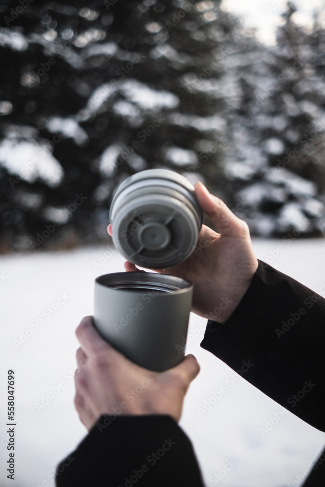person opening a cup person opening a cup