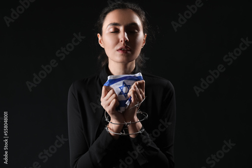 Young woman with flag of Is...