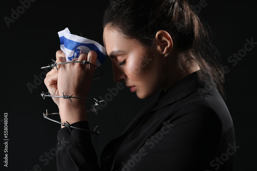 Young woman with flag of Is...