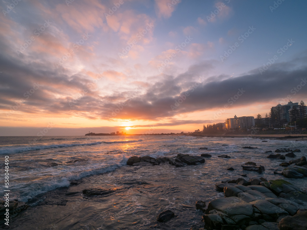 Coastal Sunrise with Waves Crashing