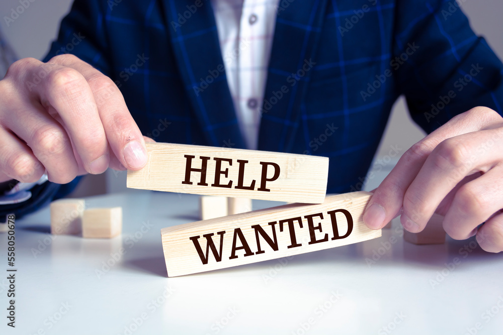 Obraz premium Wooden blocks with words 'HELP WANTED'. Business concept