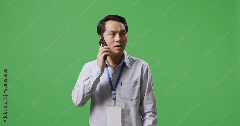 Asian Business Man Talking On Mobile Phone On Green Screen In The Studio
Asian Business Man Talking On Mobile Phone On Green Screen In The Studio