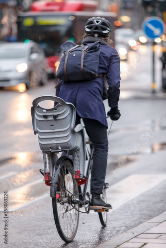 Scandinavian hip woman or man on bike.