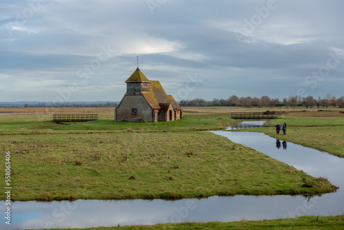 Three ladies photographing the Thomas a Becket Church