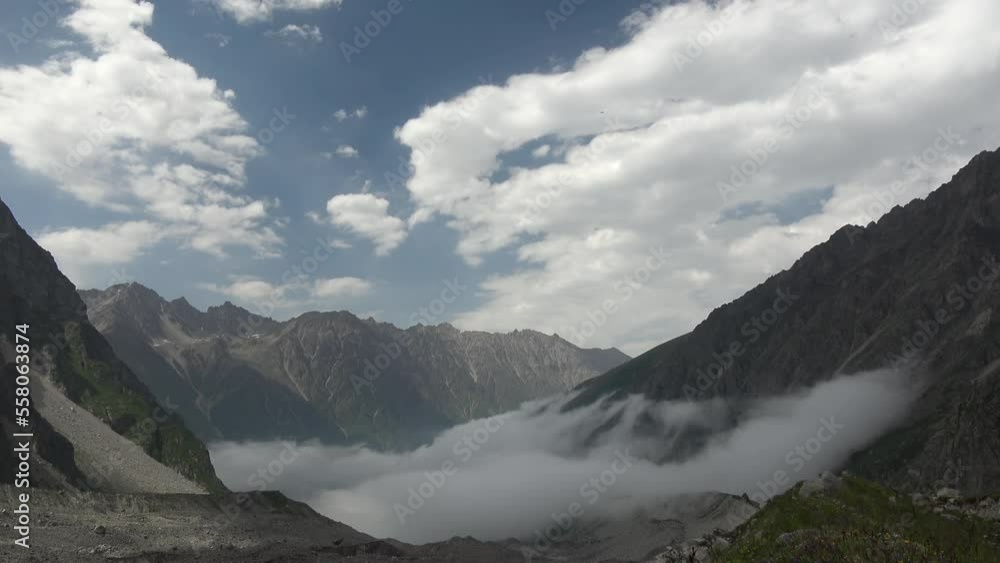 Caucasus, Mizhergi gorge. Clouds in the valley. Caucasus, Mizhergi gorge. Clouds in the valley.