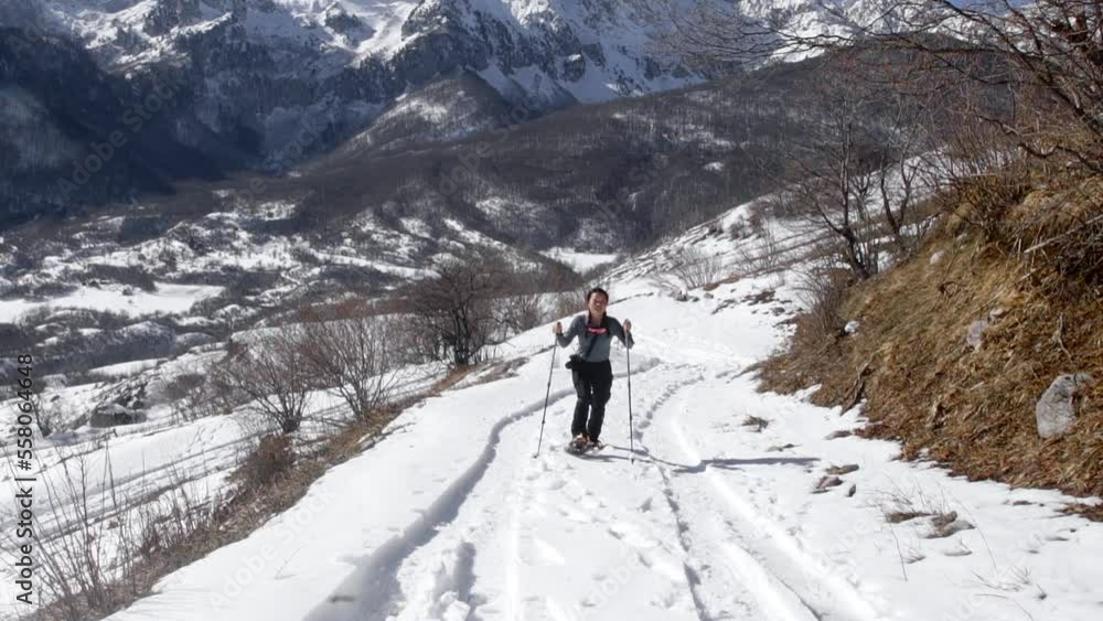 Young Lady Snowshoeing, Hiking In Beautiful Snowy Nature, North Macedonia Young Lady Snowshoeing, Hiking In Beautiful Snowy Nature, North Macedonia