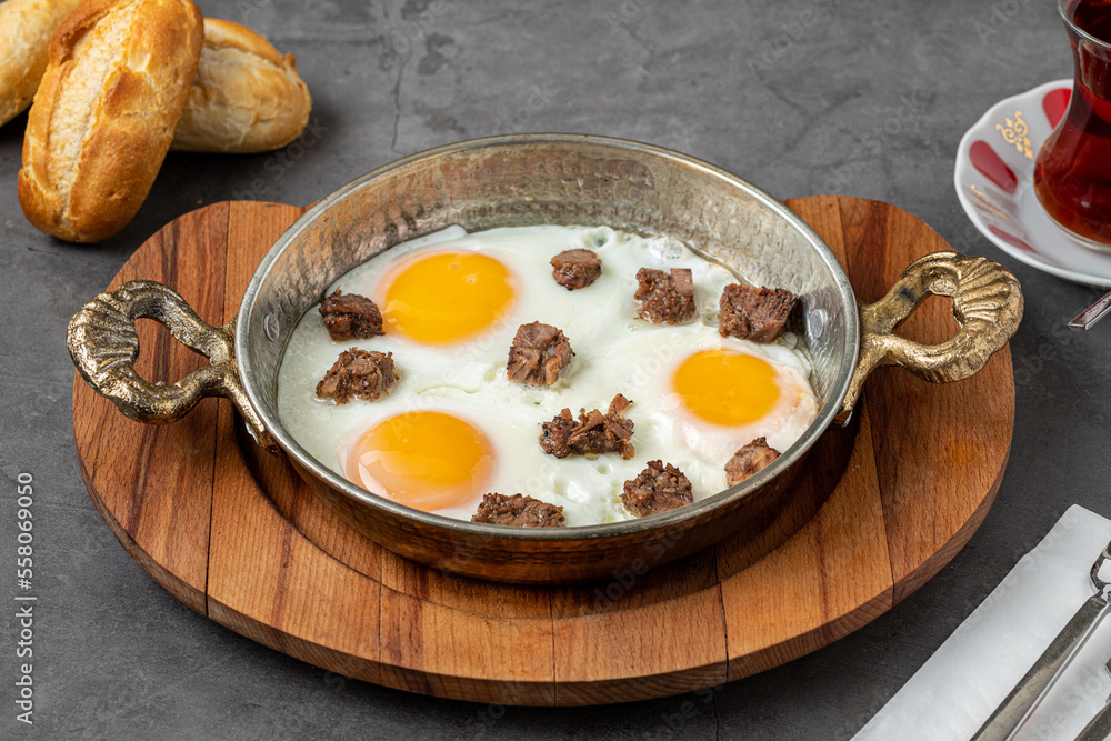 Turkish scrambled eggs Turkish name Kavurmali Yumurta with roasted meat in copper pan Turkish scrambled eggs Turkish name Kavurmali Yumurta with roasted meat in copper pan