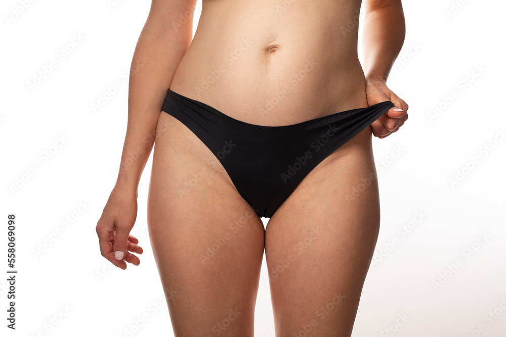 woman body abdomen wearing black soft lingerie, microfibre underwear, seamless brazilian briefs