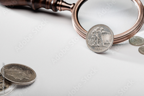 Numismatics. Old collectible coins on the table. photo