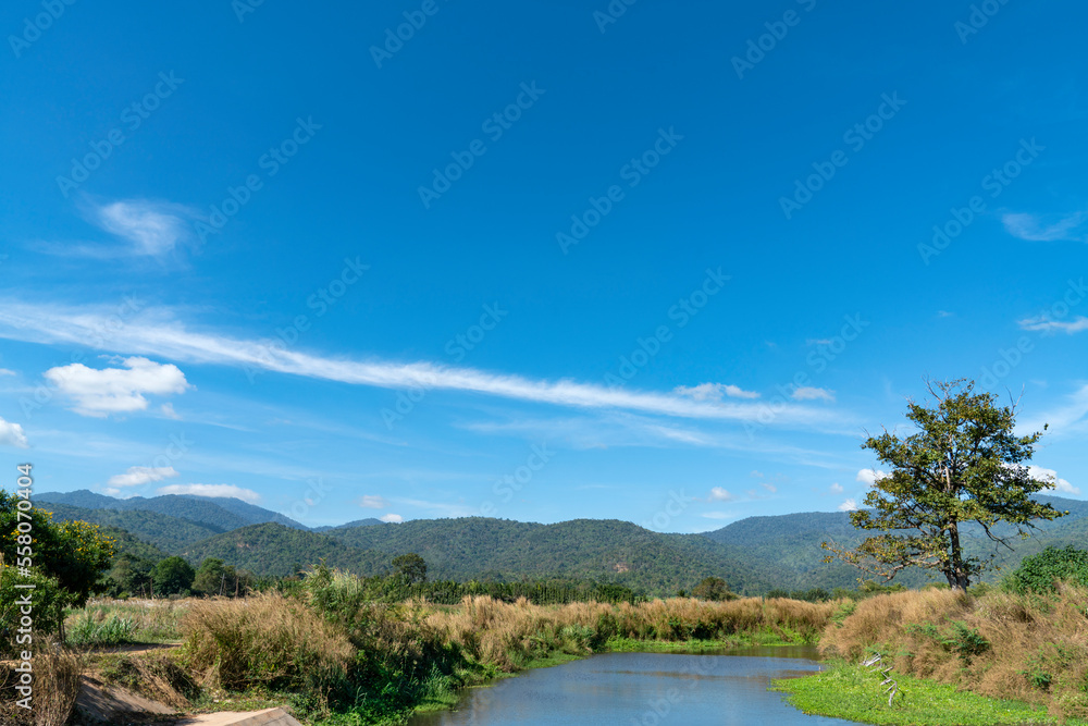 sky with clouds, lake, mountain summer landscape in thailand