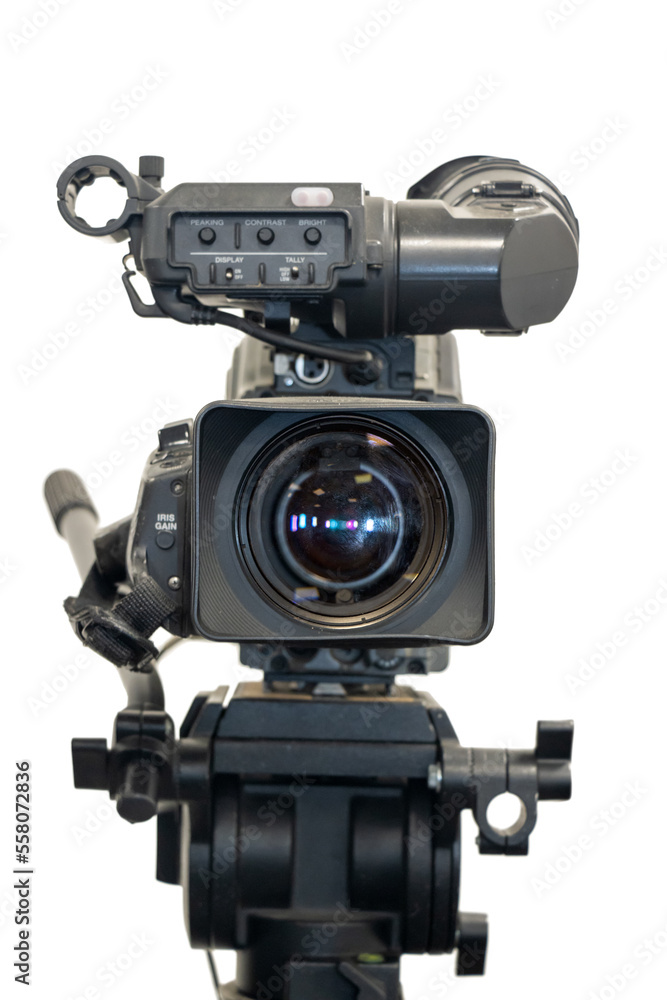 Old studio video camera on tripod, a front view, isolated on white background