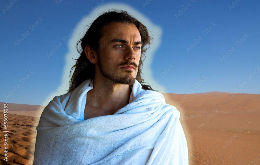 Handsome, bearded and white-robed holy man in desert resembling Jesus the Lord