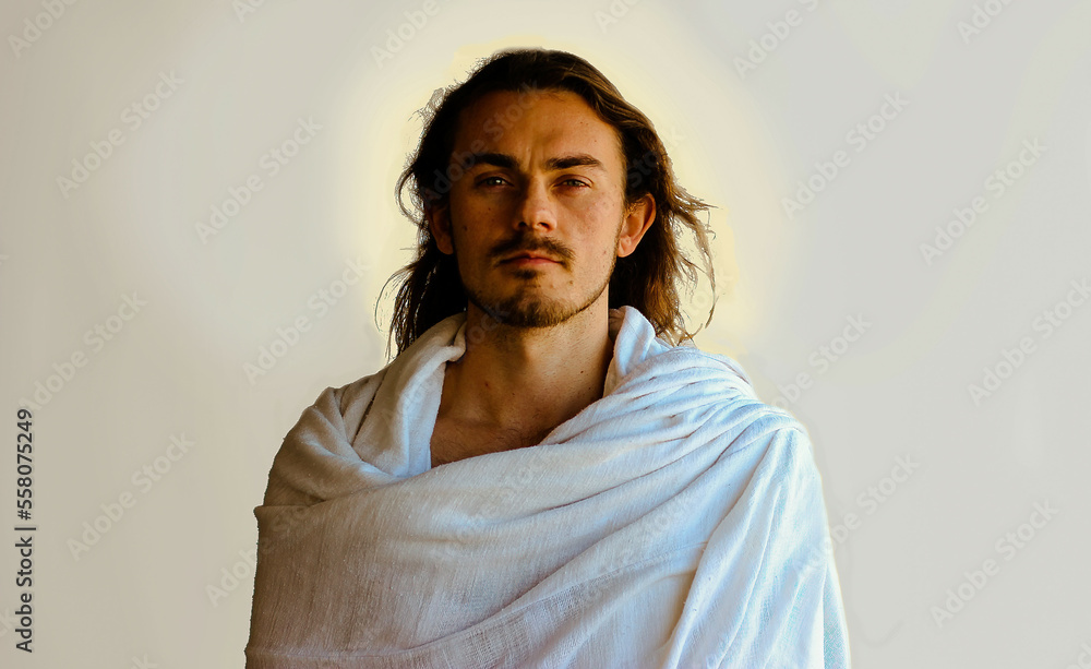 portrait of a man looks like Jesus with white robe, halo and beard
