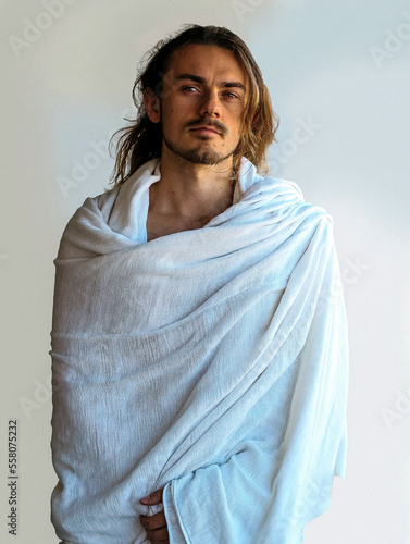 Obraz na płótnie Beautiful bearded man in white robe resembles Christ Jesus w salonie