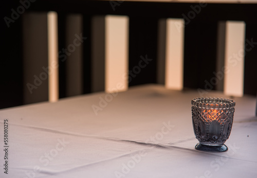 Lamp on wooden table during sunset