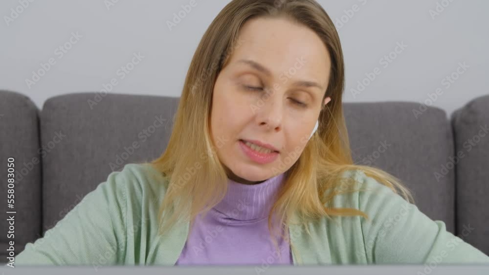 Online teacher speaking on web camera during video call. Adult white woman teaching students over internet Online teacher speaking on web camera during video call. Adult white woman teaching students over internet