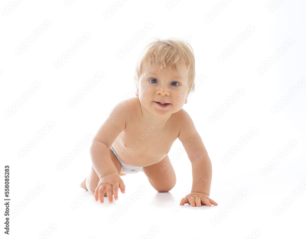 Little, happy and smiling cute baby in the studio. Portrait of a one year old baby. The concept of happiness. Little, happy and smiling cute baby in the studio. Portrait of a one year old baby. The concept of happiness.