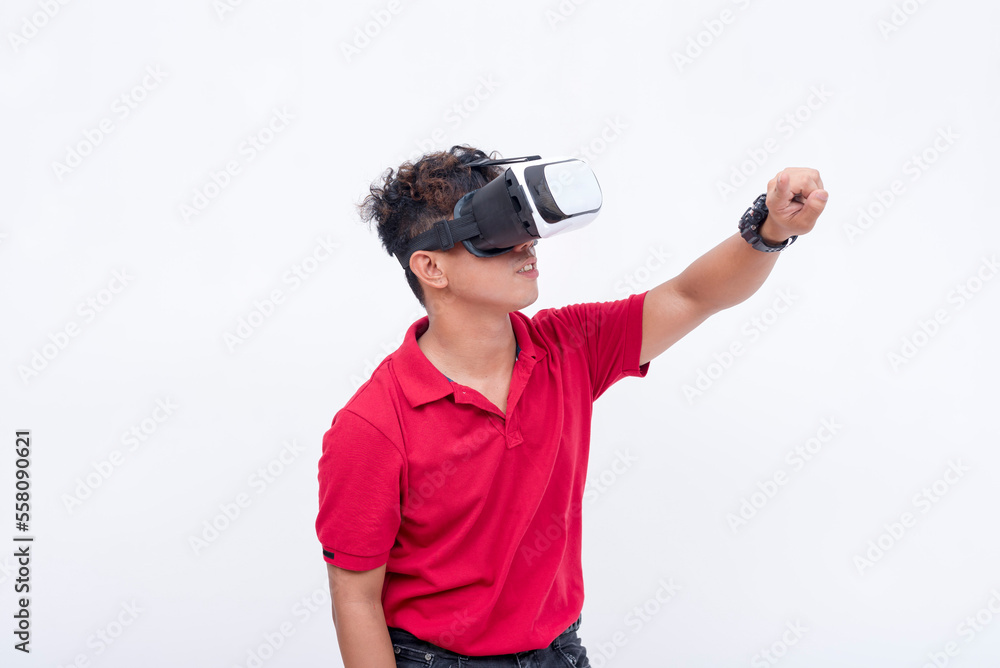 A young man knocks on a virtual door. Interacting with a VR environment using a virtual reality headset A young man knocks on a virtual door. Interacting with a VR environment using a virtual reality headset