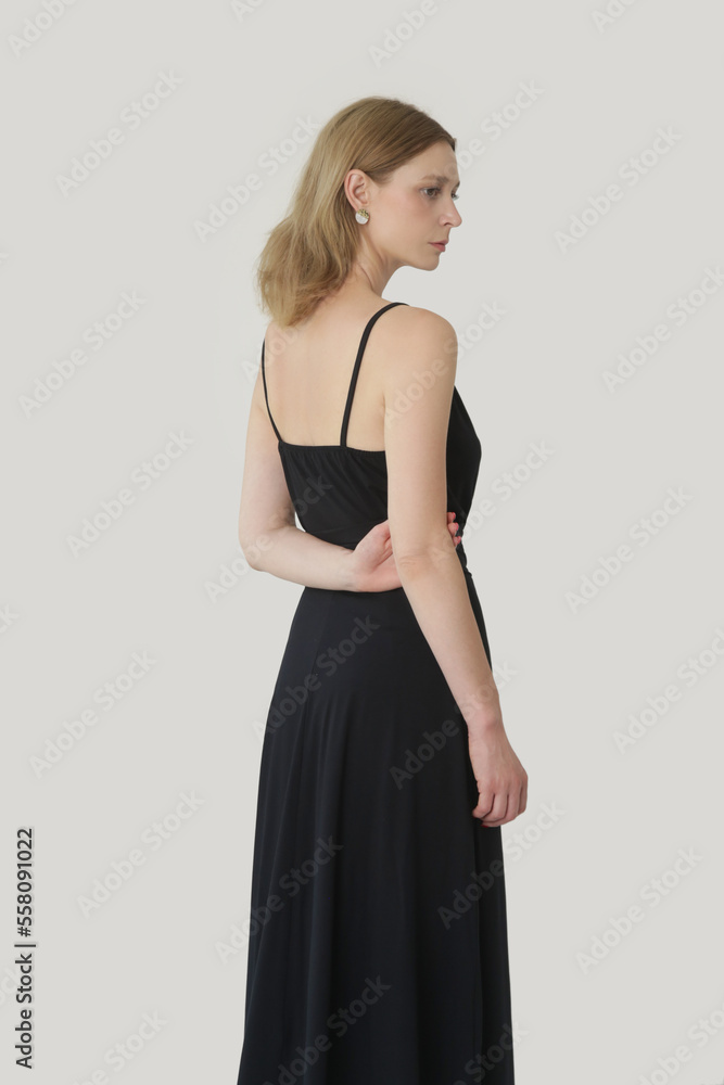 Serie of studio photos of young female model in comfortable yet stylish cotton black dress Serie of studio photos of young female model in comfortable yet stylish cotton black dress