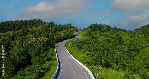 The highway stairs to the sky of road trough with green forest  as the nature landscape background