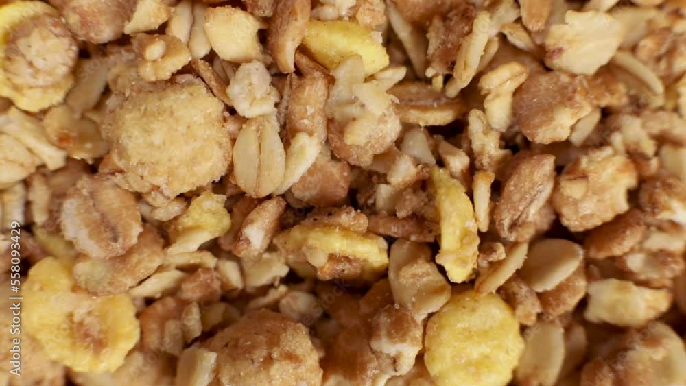 Raw oat granola with nuts and fruits. Macro, selective focus Raw oat granola with nuts and fruits. Macro, selective focus