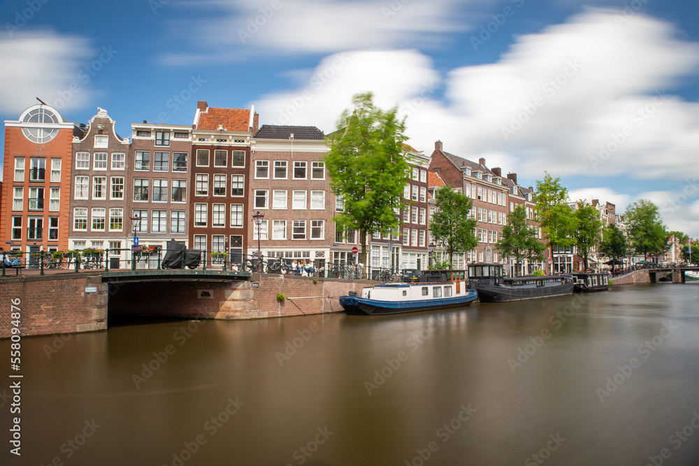 amsterdam canal long exposure with smooth water and clouds