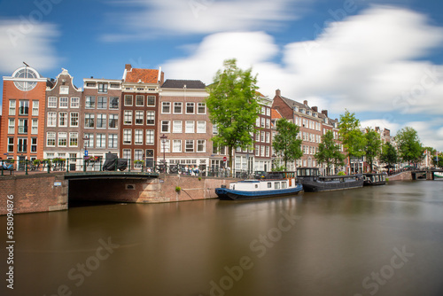 amsterdam canal long exposure with smooth water and clouds © Neunerphotography
