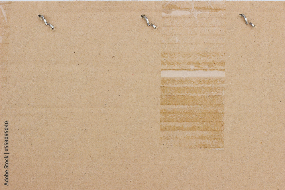 cardboard paper texture background. Kraft paper texture with staples