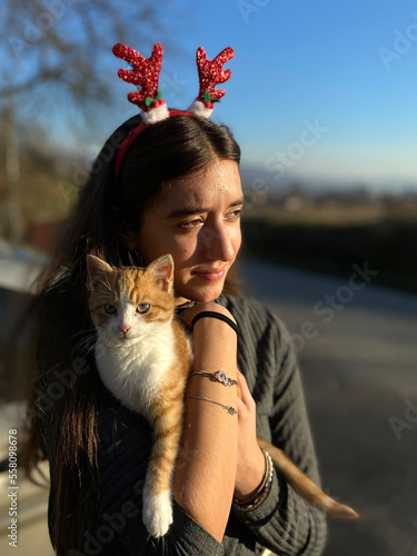  portrait of young  girl with small kitten