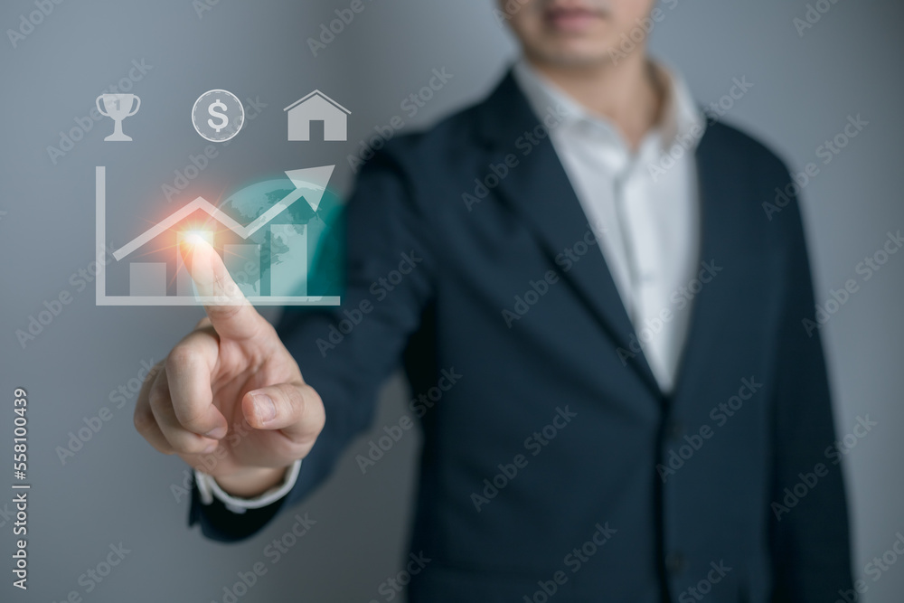Businessman to touch in peak of Business graph. growth increase of chart positive indicators in his business Businessman to touch in peak of Business graph. growth increase of chart positive indicators in his business