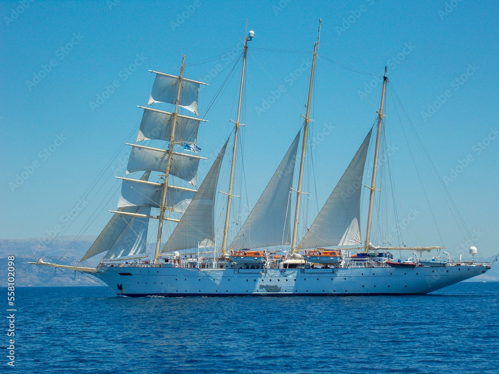 Classic yacht under full sail in blue ocean