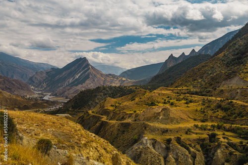 Changeable weather in the Caucasus Mountains. Panoramic view.