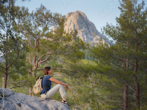 woman traveler walking by Lycian Way trail mountains in Turkey near Antalya. concept of living open-air, physical and mental well-being, digital detox © YURII Seleznov