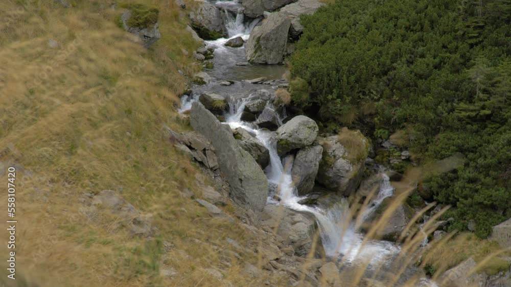 Small Waterfall Flowing Through The Rocks Small Waterfall Flowing Through The Rocks