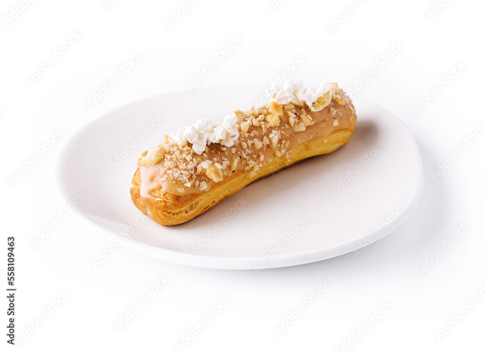 Caramel eclair on white plate isolated Caramel eclair on white plate isolated