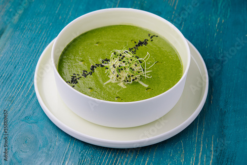 Plate of broccoli and green peas cream soup
