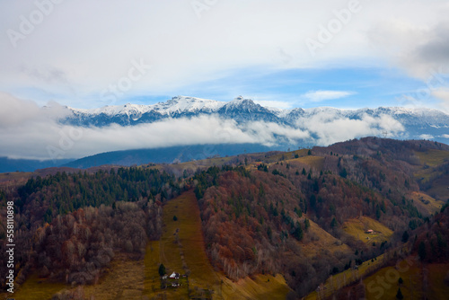 Beautiful landscape with the Bucegi mountains in Romania with the ridges covered with snow.