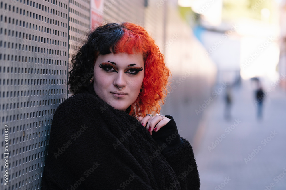 Transgender girl with painted hair posing to the camera. Stock Photo