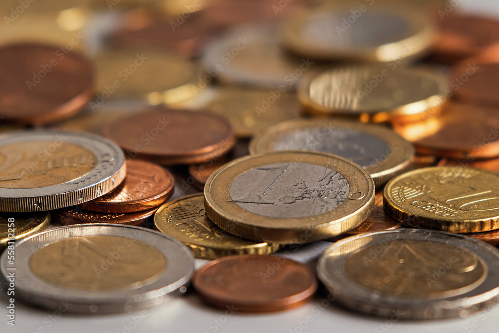Spilled coins. Euro coins on the table close-up. Soft focus Spilled coins. Euro coins on the table close-up. Soft focus