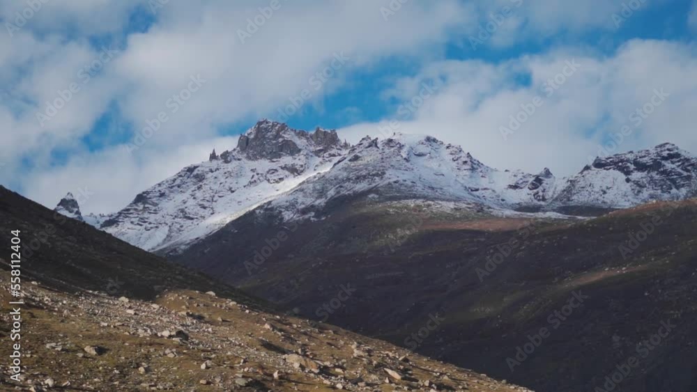 Beautiful landscape view of snow covered mountain peaks in background of cloudy sky during winter at Lahaul and Spiti, Himachal Pradesh, India. Nature background. Beautiful landscape view of snow covered mountain peaks in background of cloudy sky during winter at Lahaul and Spiti, Himachal Pradesh, India. Nature background.