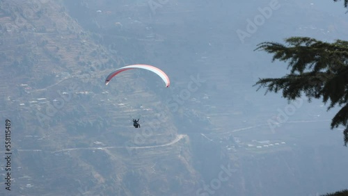 Paragliding at Solang Valley Kullu Manali Himachal Pradesh India. Beautiful Indian mountain in Himalayas. photo